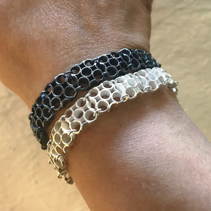 silver link bracelets on wrist