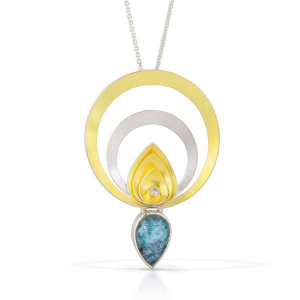 silver and gold circle pendant with Blue Brazilian Gilelite tear drop 